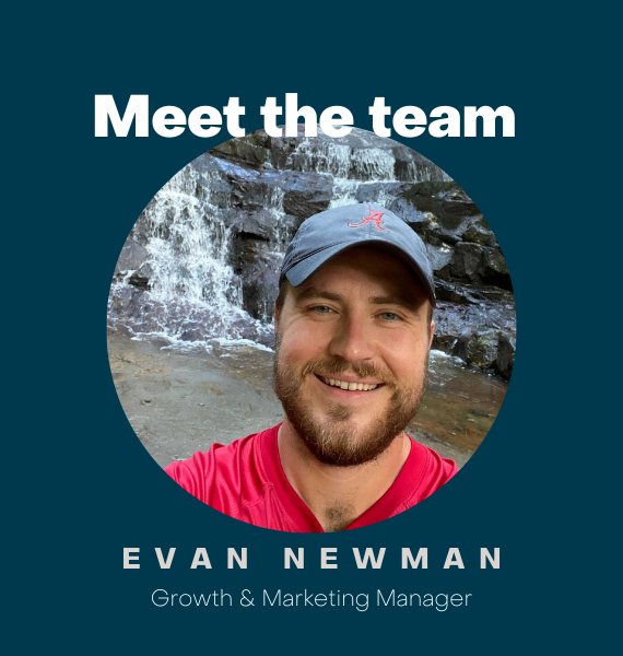 Evan Newman standing in front of waterfall